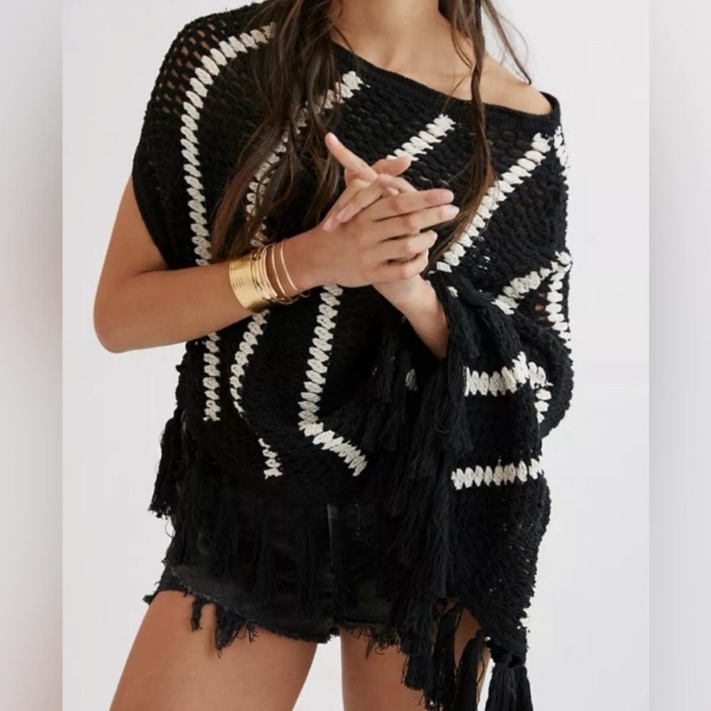 Anthropologie One Shoulder Crocheted
Poncho Black an white. One size
